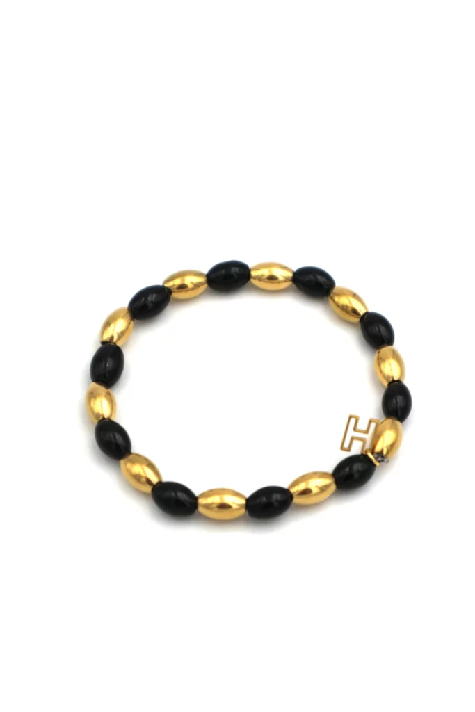 bracelet pour femme doré et noir élastique, perles noires en plastique, acier inoxydable plaqué or 18 carats, le comptoir rouen le havre