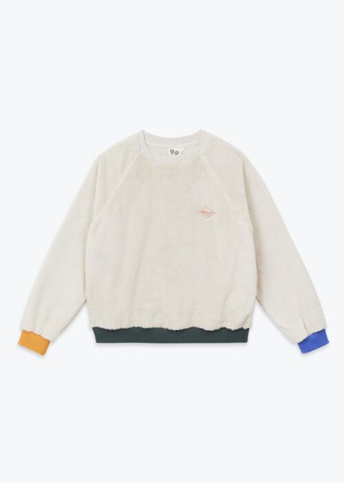 Sweat pour femme en sherpa écru et détails tricolores et logo AP & Co. 100% polyester. Fabriqué au Portugal. Référence H25WS02 Arsène et les Pipelettes.